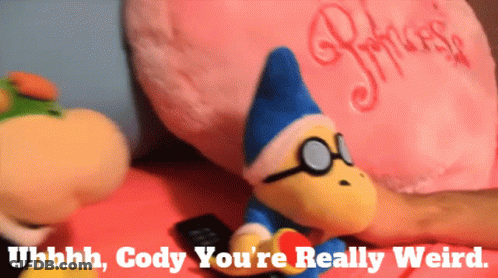 Stuffed Animal With Glasses Next To Princess Pillow GIF