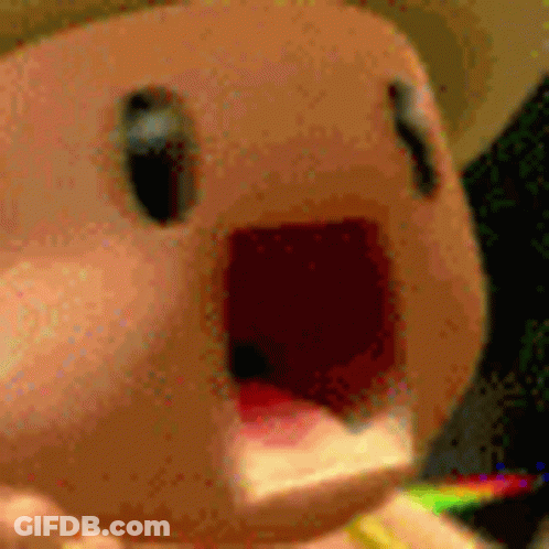 Stuffed Animal With Rainbow In Mouth GIF