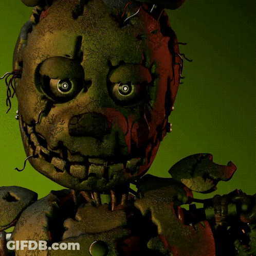 Stuffed Animal With Red Eye On Green Background GIF