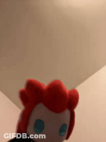Stuffed Animal With Red Hair And Blue Eyes GIF