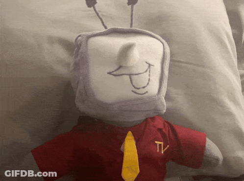 Stuffed Animal With TV Logo On Shirt And Tie GIF