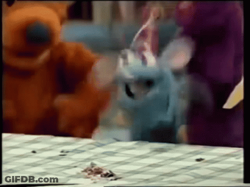 Stuffed Animals Around Checkered Table GIF