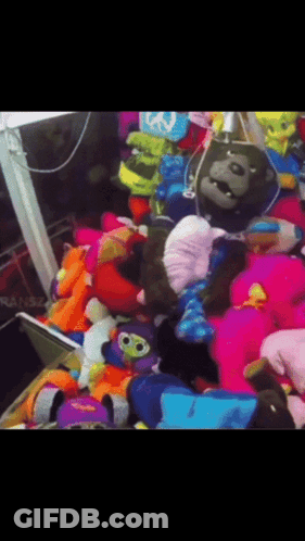 Stuffed Animals Including Gorilla With Peace Sign GIF