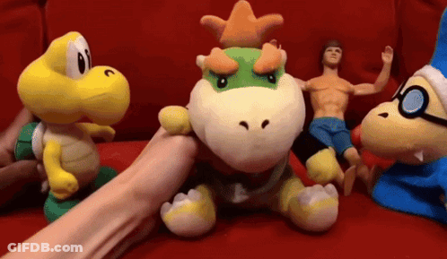 Stuffed Animals On Red Couch With Bowser GIF