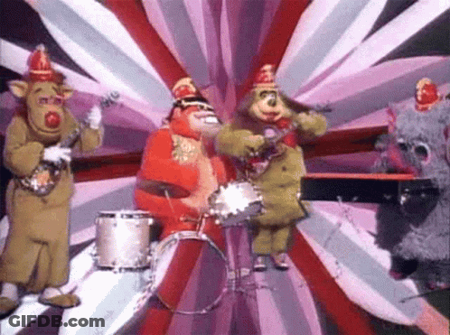 Stuffed Animals Playing Instruments On Stage GIF