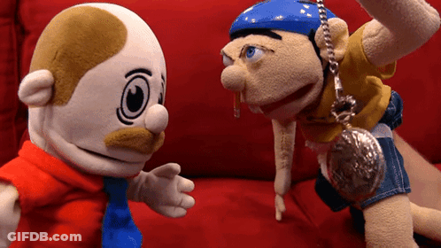 Stuffed Animals Sitting On Red Couch GIF