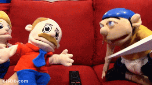 Stuffed Animals Sitting On Red Couch Remote Control GIF
