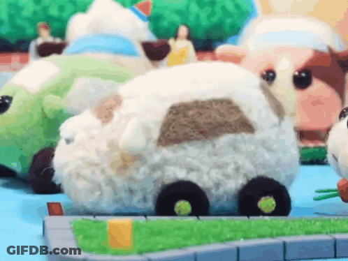 Stuffed Animals Sitting On Table GIF