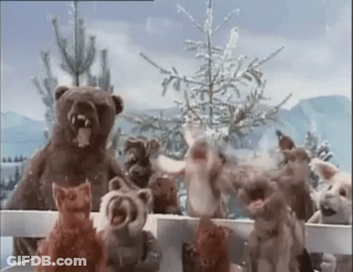 Stuffed Animals Standing Behind Fence GIF