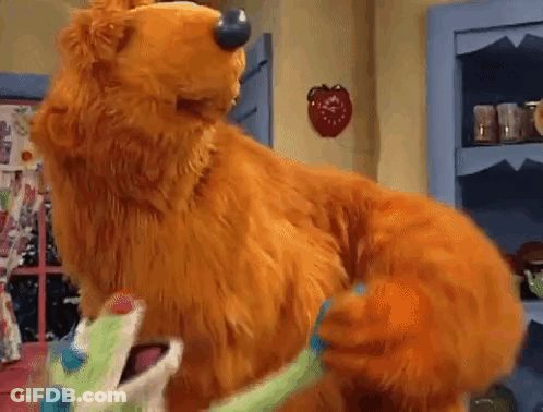 Stuffed Bear Standing On Hind Legs In Room GIF