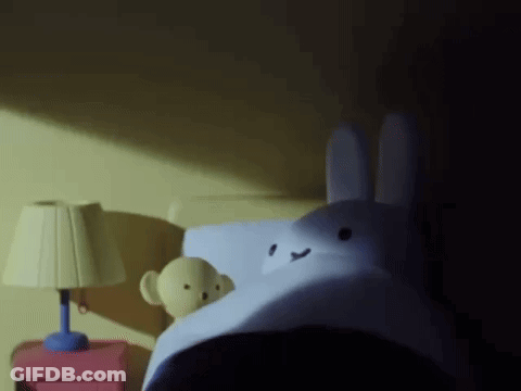 Stuffed Bunny Lying On Bed GIF
