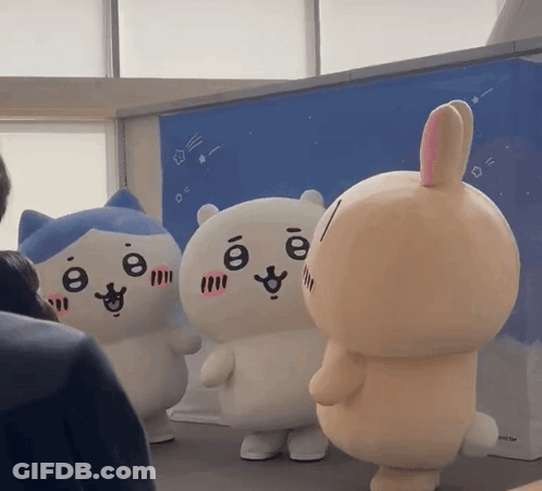 Stuffed Cat And Bunny Standing Together GIF