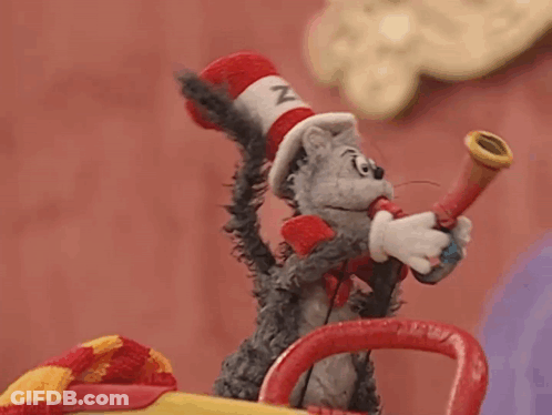 Stuffed Cat In Hat Blowing Horn GIF