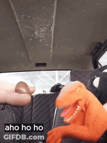 Stuffed Dinosaur In Back Seat Saying Aho Ho Ho GIF