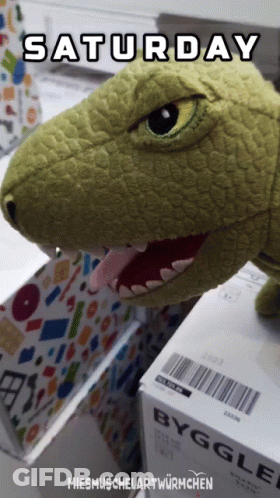 Stuffed Dinosaur Sitting On Byggle Box GIF