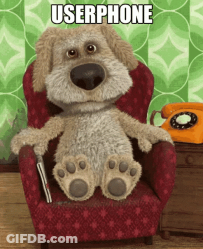 Stuffed Dog Sitting In Red Chair GIF