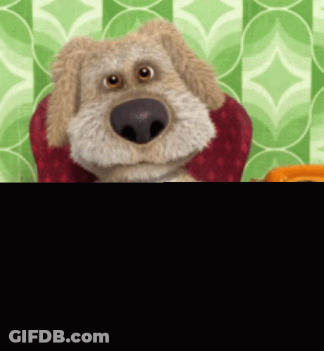 Stuffed Dog Sitting Next To Orange Phone GIF