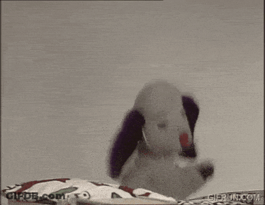 Stuffed Dog Wearing Headphones And Waving GIF