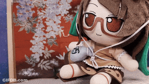 Stuffed Doll Wearing Glasses And Headphones GIF