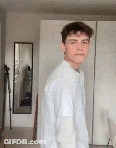 Stuffed Doll With Headphones Holding Camera GIF