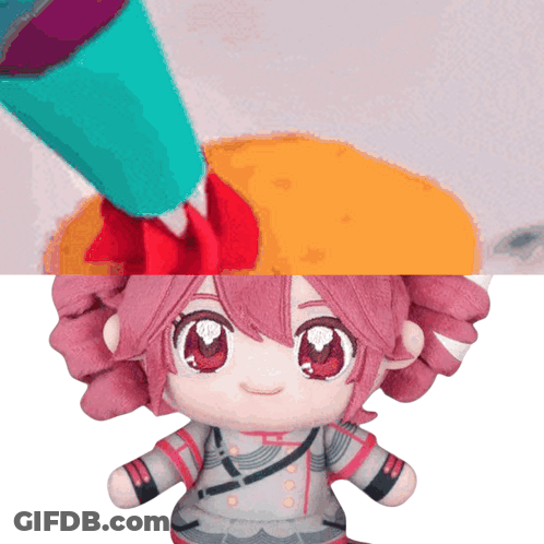 Stuffed Doll With Pink Hair And Red Eyes Being Painted GIF
