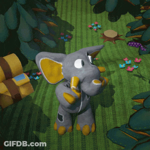 Stuffed Elephant With Yellow Ears On Green Field GIF