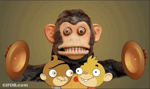Stuffed Monkey Surrounded By Two Cartoon Characters GIF