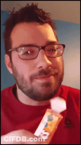 Stuffed Mouse Next To Person Eating Sandwich GIF