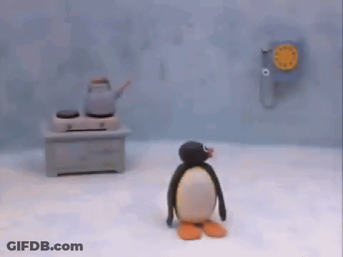 Stuffed Penguin Next To Man With Headphones GIF