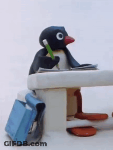 Stuffed Penguin Sitting At Table With Pencil GIF