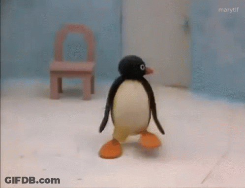 Stuffed Penguin Walking On Snow GIF