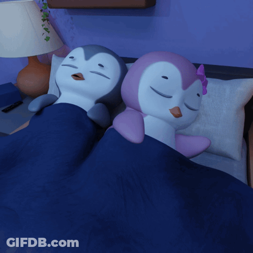 Stuffed Penguins Sleeping On Bed GIF