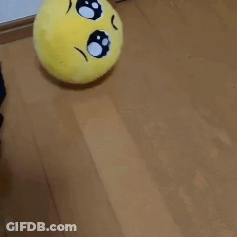 Stuffed Smiley Face Sitting GIF