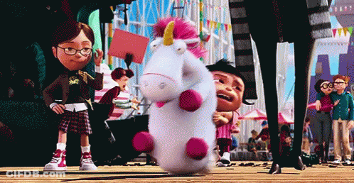 Stuffed Unicorn With Pink Horn Held By Girl In Glasses GIF