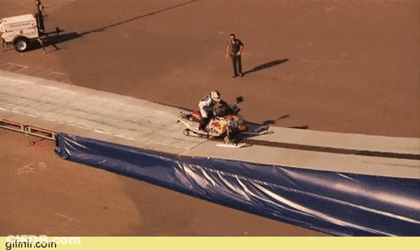 Successful High Snowmobile Jump GIF