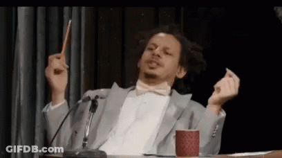 Suit And Bow Tie Man At Microphone With Pencil GIF
