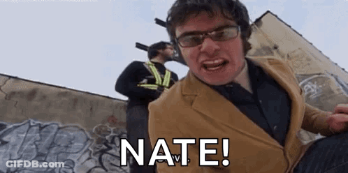 Suit And Glasses Man Yelling At Graffiti Wall GIF