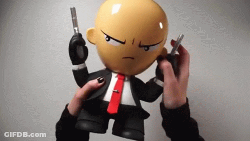 Suit And Tie Cartoon Holding Two Guns GIF