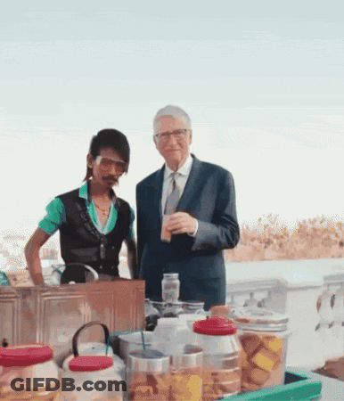 Suit And Tie Man Beside Green Shirt Man GIF