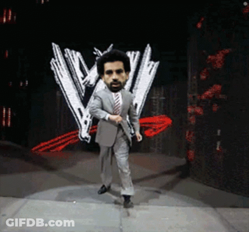 Suit And Tie Man Dancing On Stage With W Logo GIF