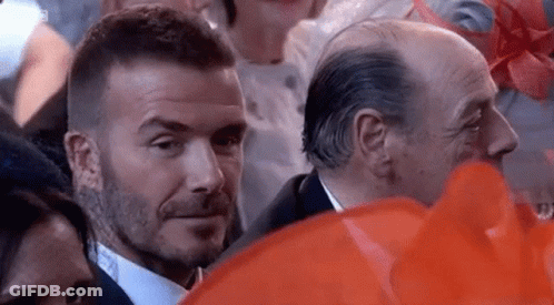 Suit And Tie Man Eyes Another In Crowd GIF