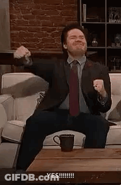 Suit-And-Tie Man Holding Coffee Arms Outstretched GIF