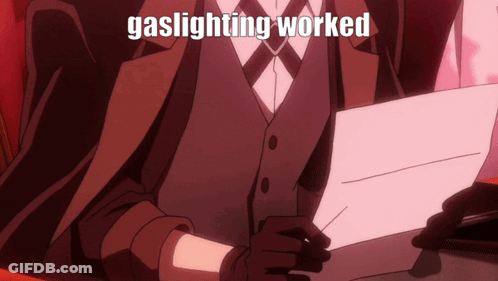 Suit And Tie Man Holding Gaslighting Worked Sign GIF