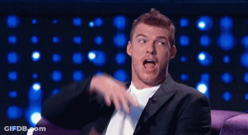 Suit And Tie Man Open Mouth On Couch GIF