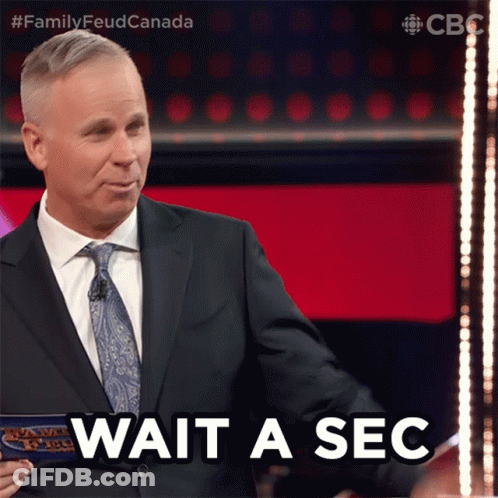 Suit-And-Tie Man Saying Wait A Sec GIF