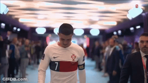 Suit-And-Tie Man With Soccer Player In White GIF