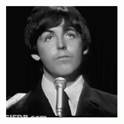 Suit-And-Tie Young Man Singing Into Microphone GIF