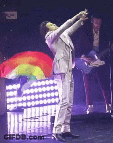 Suit Man Arms Up Rainbow Flag GIF