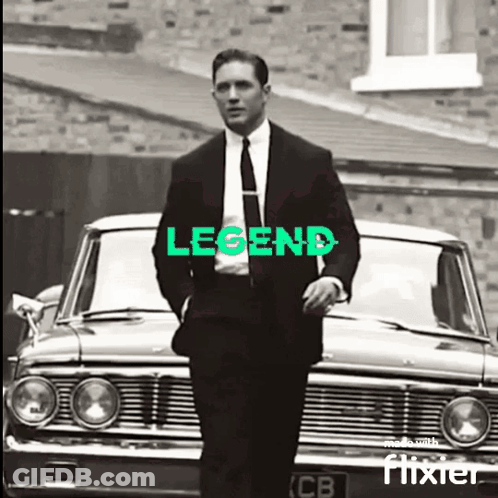 Suit Man Beside Car With Legend GIF