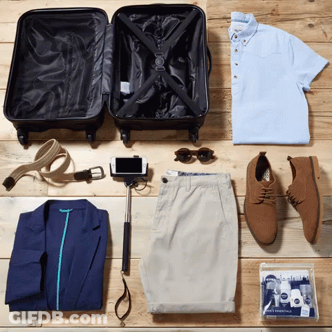 Suitcase Surrounded By Clothes And Selfie Stick GIF
